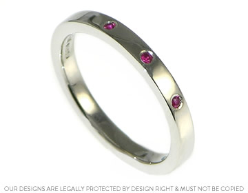 Mike and Lillian's platinum eternity ring with crisp red rubies