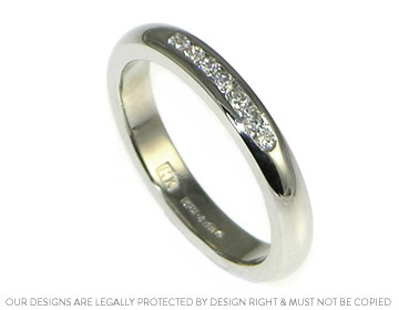 Bespoke platinum ladies wedding ring with diamonds for added sparkle