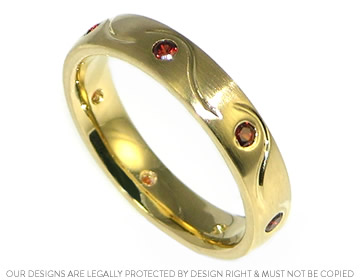 Alison wanted rich red garnets in her yellow gold wedding ring