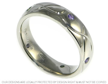 Palladium wedding band with engraved detail and sapphires