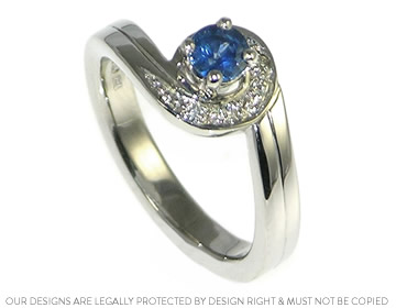 Handcrafted sapphire and diamond engagement and wedding ring set.