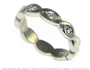 Mark and Karen's palladium eternity ring with pale blue aquamarines