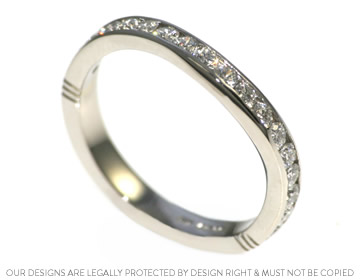 Handmade platinum eternity ring with a gentle sweeping design