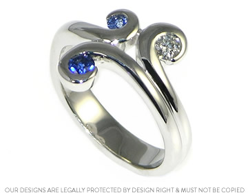 Mike and Liz's sapphire and diamond eternity ring with a swirling design