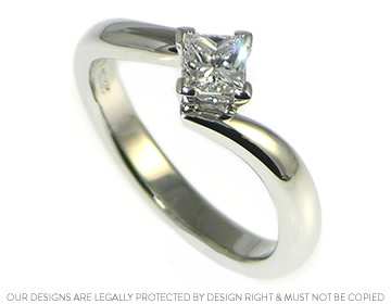 Sparkly platinum twist style engagement ring with a crisp diamond 