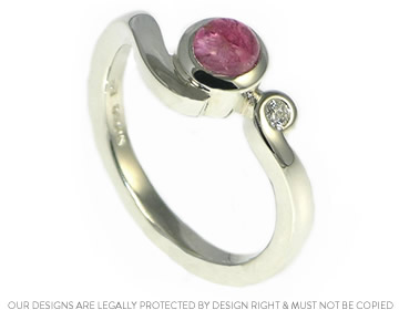 Cabochon cut fairly traded Ruby in a 9ct white gold engagement ring