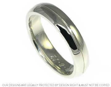 Andy's 9ct white gold wedding ring with an engraved line.