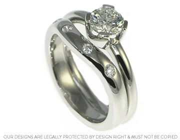 Sarah's platinum wave style fitted wedding ring and engagement ring