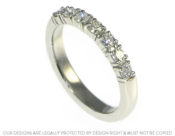 Palladium wedding ring with brilliant cut diamonds