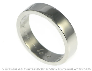 Simon's palladium wedding ring with engraving on the inside