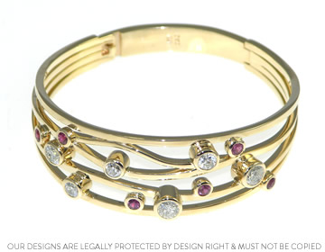 Sally's sparkly yellow gold, diamond and ruby bracelet