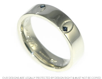 Joshua's sapphire wedding ring with engraved detail for an added flair