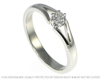 Jo's platinum engagement ring with a beautiful diamond in a claw setting 