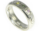 bespoke silver eternity ring with birthstones and engraved details