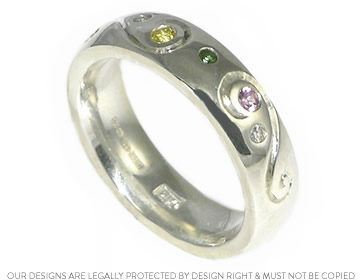 Bespoke silver eternity ring with birthstones and engraved details