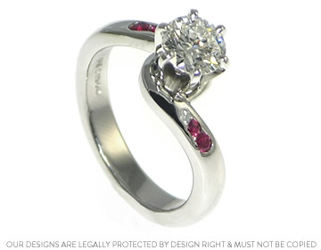 Platinum twist style engagement ring with diamond and rubies