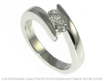 Platinum twist style ring with brilliant cut diamonds