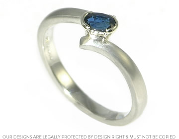 Nick wanted a striking blue stone in Emma's engagement ring