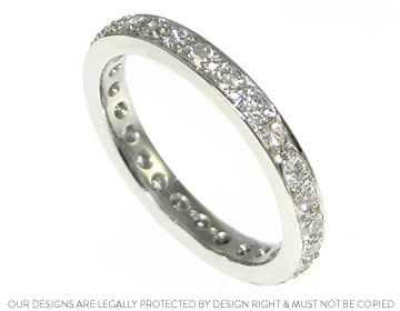 Platinum wedding ring with twenty six pave set diamonds