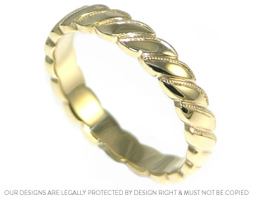 9ct yellow gold Celtic style ring with mill-grained detail 