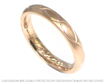 Isabel's 9ct rose gold wedding ring with intertwining  engraved waves