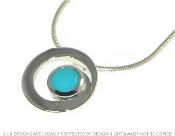 Sterling Silver 'C' inspired pendant with a cabochon cut turquoise