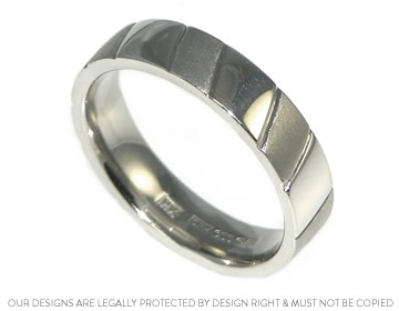 Keith's palladium wedding ring with diagonal engraving