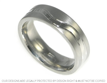 Lee's platinum wedding ring with a beautiful engraved wave with a polished finish