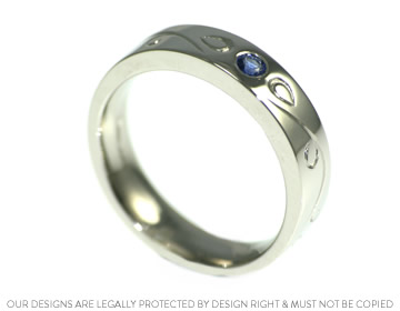 Alan's wedding ring with blue sapphires and engraving