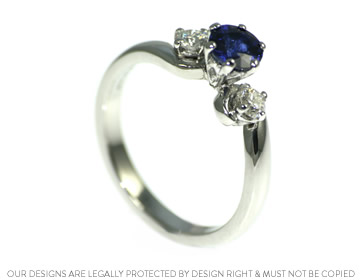 Laura's deep blue sapphire trilogy engagement ring