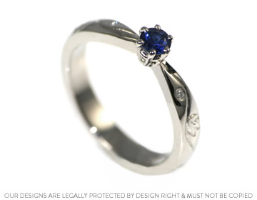 Erica's blue sapphire engagement ring with vine engraving