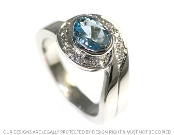 A 9ct white gold bespoke wave inspired aquamarine ring 