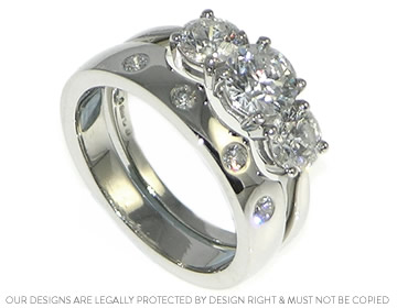 Andrea's fitted wedding ring with four invisibly set diamonds