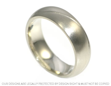 Gareth's unusual wedding ring with a satin finish and engraved detail