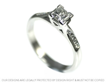 Sus' princess cut platinum diamond engagement ring with a twist