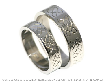 A unique pair of platinum wedding rings with Celtic engraving