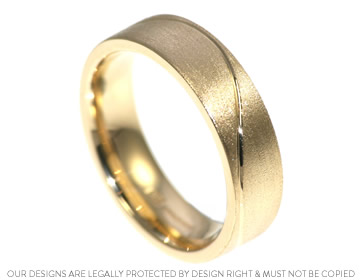 Greg's 9ct yellow gold wedding ring with an engraved wave