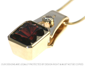 Stunning optix octagonal cut garnet and diamond pendant