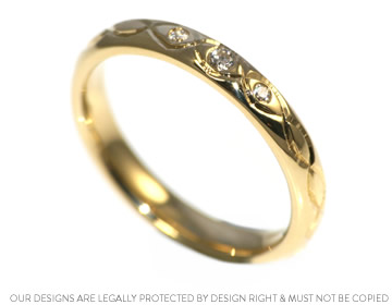 Celtic knot inspired yellow gold and diamond wedding ring