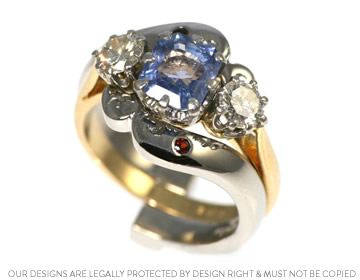 Nicola's crashing waves palladium and garnet cage style wedding ring