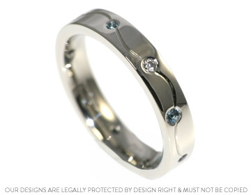 Platinum eternity ring with beautiful scatter set stones