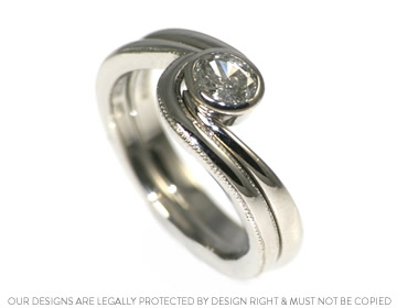 A beautiful mill-grained fitted wedding ring