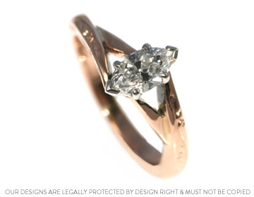 An antique style engagement ring crafted in mixed metals