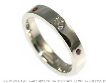 A ruby and diamond scatter set ladies wedding ring