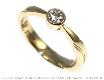 A simple but modern solitaire ring crafted in yellow gold