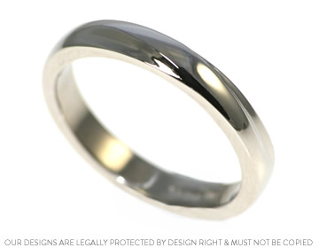 Claire's unusual shaped wedding ring to compliment her other ring