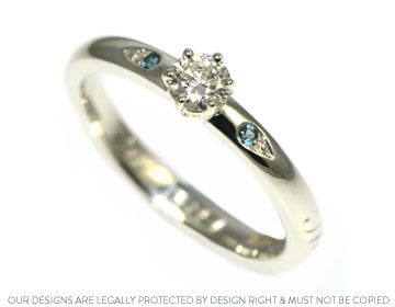 A bespoke handmade 9ct white gold, diamond and topaz engagement ring  