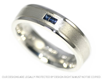 Bespoke silver engagement ring with two stunning blue sapphires