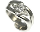 platinum cage style wedding ring with trilliant cut diamonds