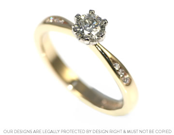 A classic mixed metal and diamond engagement ring